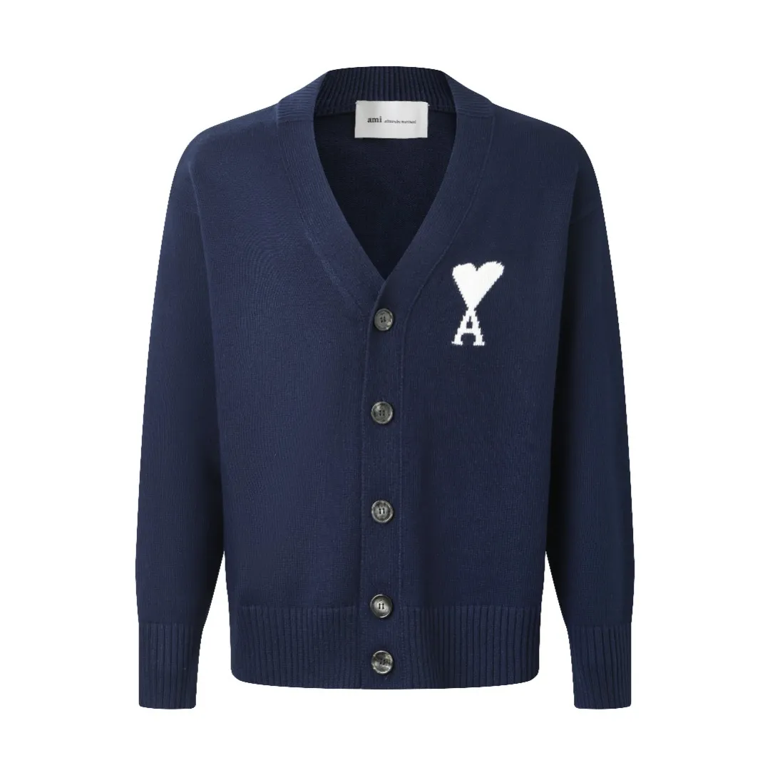 Ami love V-neck knitted cardigan is made of four-dimensional blended yarn of selected wool + cotton and nylon spandex. Each strand of yarn has undergone a "triple compound twisting" process. The wool provides natural warmth and fluffy feeling. After descaling treatment, combined with the smoothness of cotton fiber, it is close to the skin without any itch and is friendly to sensitive skin. The addition of nylon and spandex increases the fabric's rebound properties by 40%, making it less likely to wrinkle after long-term wear, and it still maintains its fluffy silhouette after machine washing. After blending, it feels soft and waxy, breaking the rough impression of traditional wool. The ADC pattern on the chest uses double-layer jacquard technology and is woven with milky white yarn. The stitch length changes to form a "cloud-like" three-dimensional texture. The edge of the pattern adopts "gradient narrowing" technology. The density of stitches from the center to the edge is from dense to sparse, giving a hazy feeling of natural smearing. The weight of the yarn in the jacquard area is 280g/m², which is 20% higher than the main body of the garment. It feels thick and full, highlighting the relief texture of the pattern. The neckline, cuffs, and hem are all made of thickened ribs, and the stitch density reaches 12 stitches per centimeter, forming a tight and elastic closing. The rib edges are added with 1% spandex and processed with "pre-shrinking and shaping" to ensure that they will not loosen or deform after multiple washings. The neckline is a V-neck design with an angle of 60°, and is paired with double-layered ribbing, which not only modifies the neck line but also enhances wearing stability. It adopts an Oversize silhouette, with the length reaching to the hips, and the overall lines are round and smooth. The two sides of the body are "slightly tightened" to retain the waistline while being loose and avoid feeling bloated. Size:S-M-L-XL